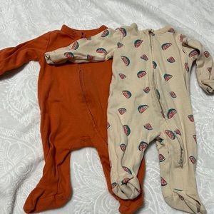 Infant 0-3 month sleeper onesies.
